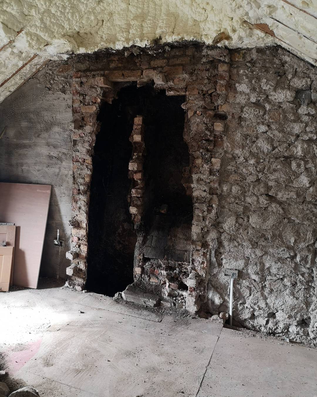 A fireplace opened right back to the brick.